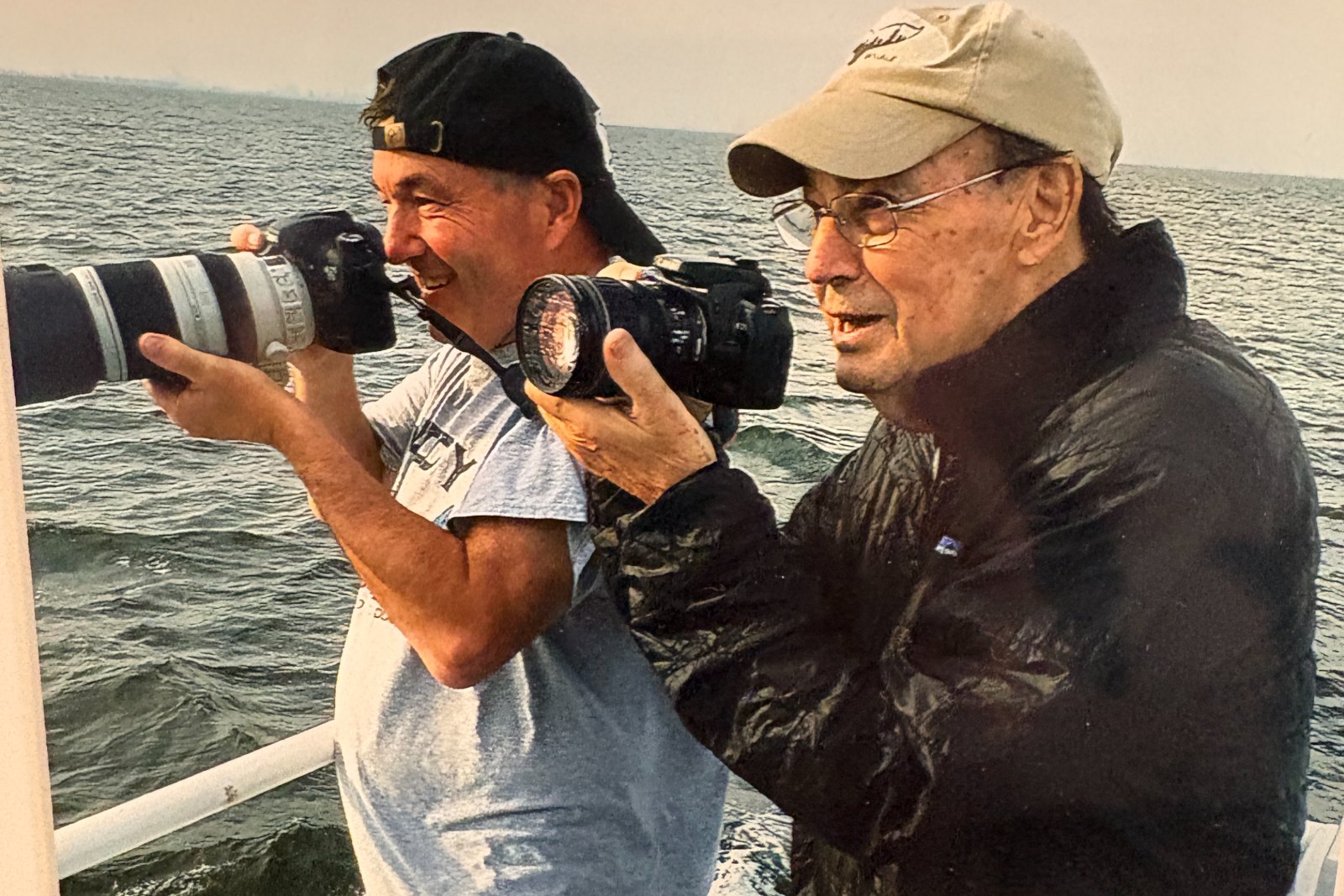 Paul L. Sieswerda Sr. and his son PJ photographing whales together off New York Harbor